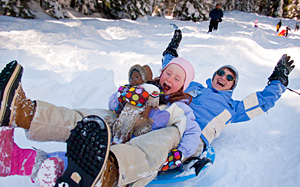 adult and child sledding